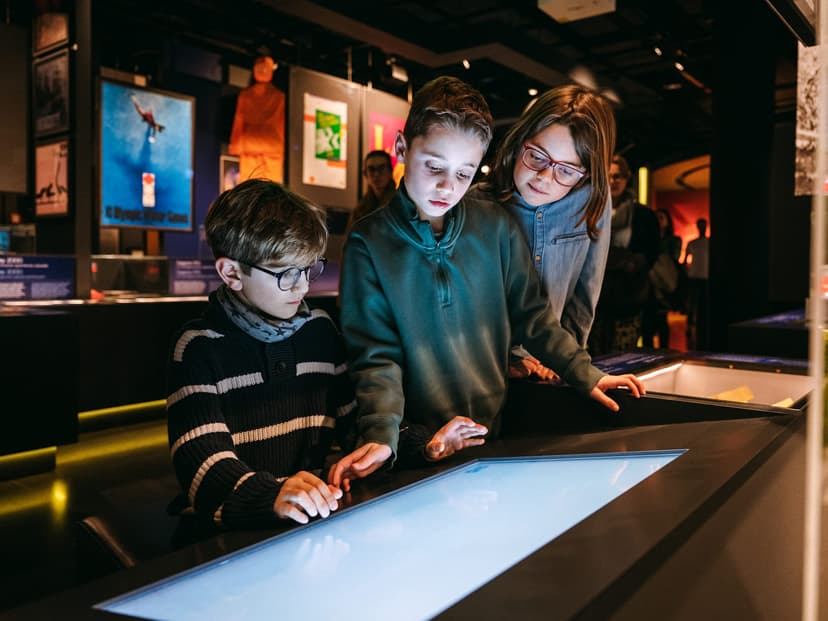 children looking at something on a screen