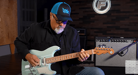 man playing a guitar