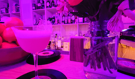 Drink at a bar with neon lights