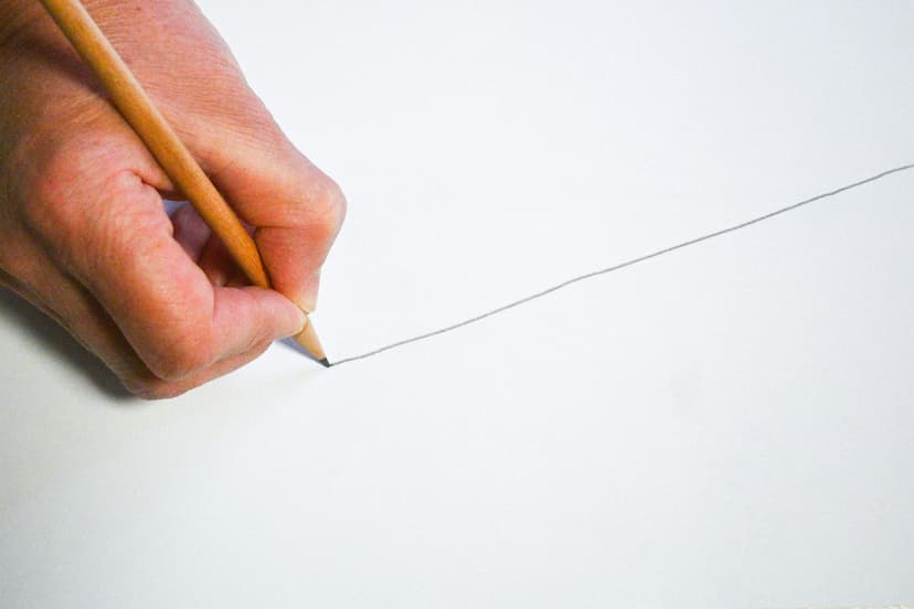 hand drawing a line with a pencil