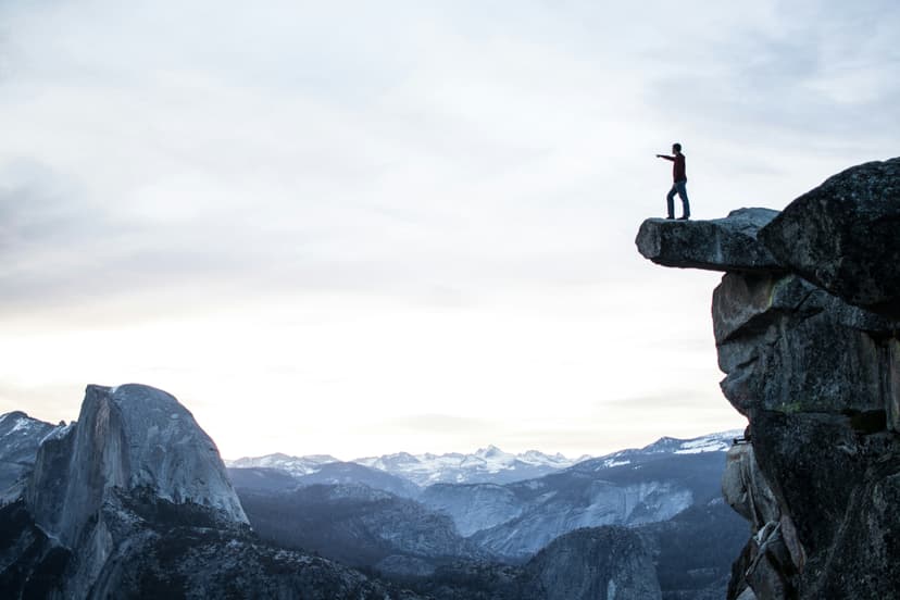 man on top of a mountain